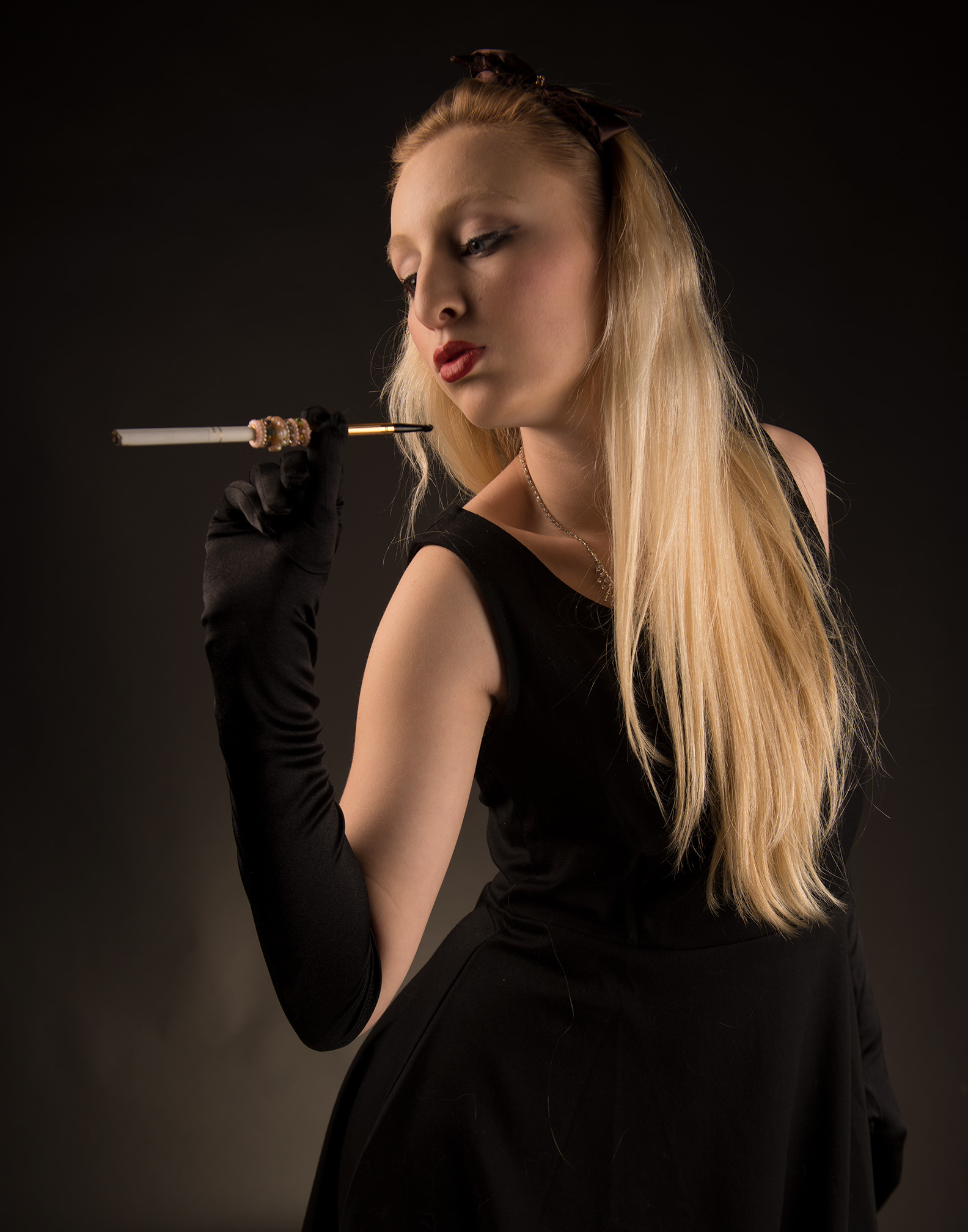 (Before Editing) Photograph of model with long cigarette and black dress