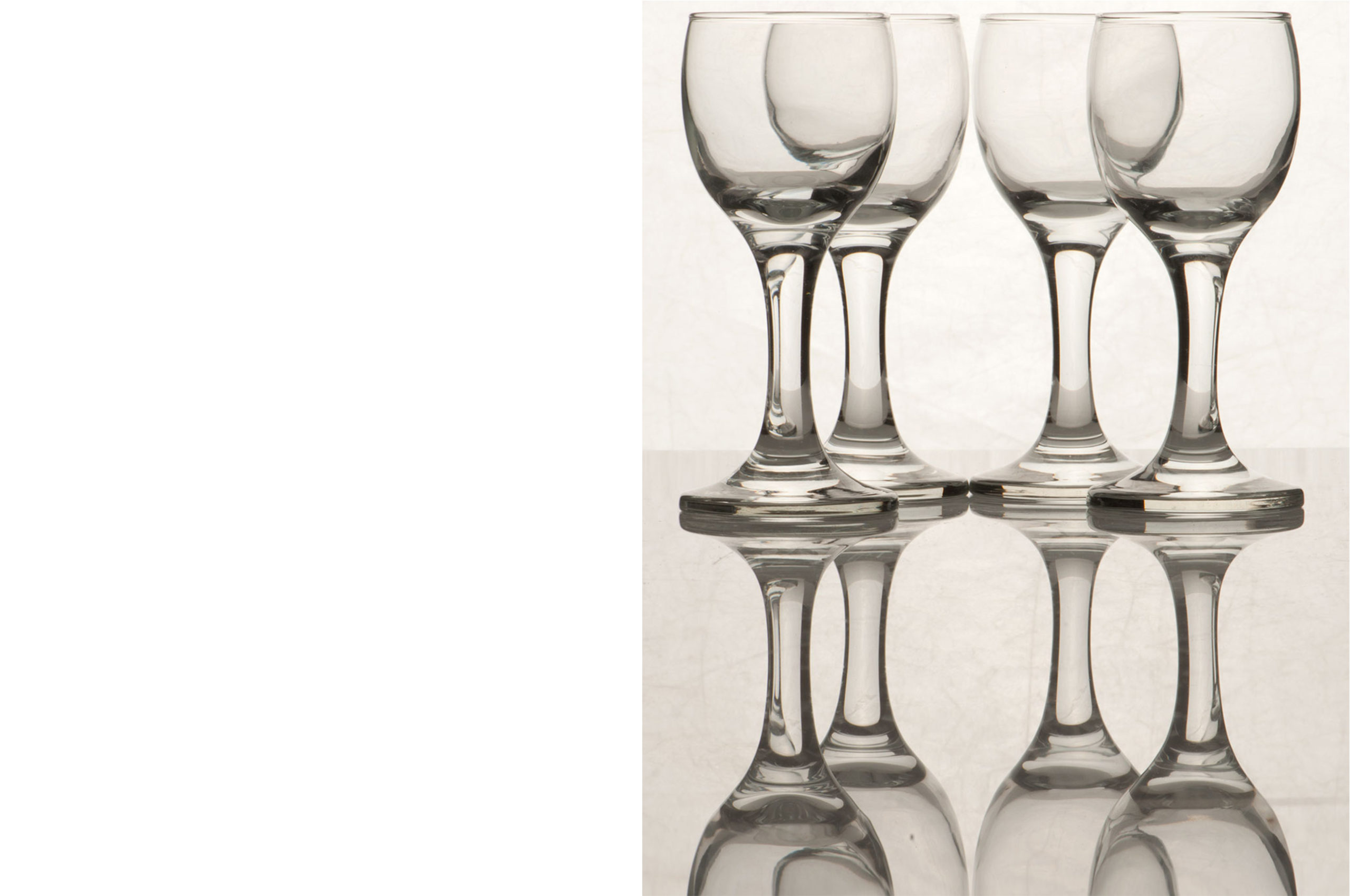 (Before Editing) Set of Glassware photographed to show reflection on clear surface