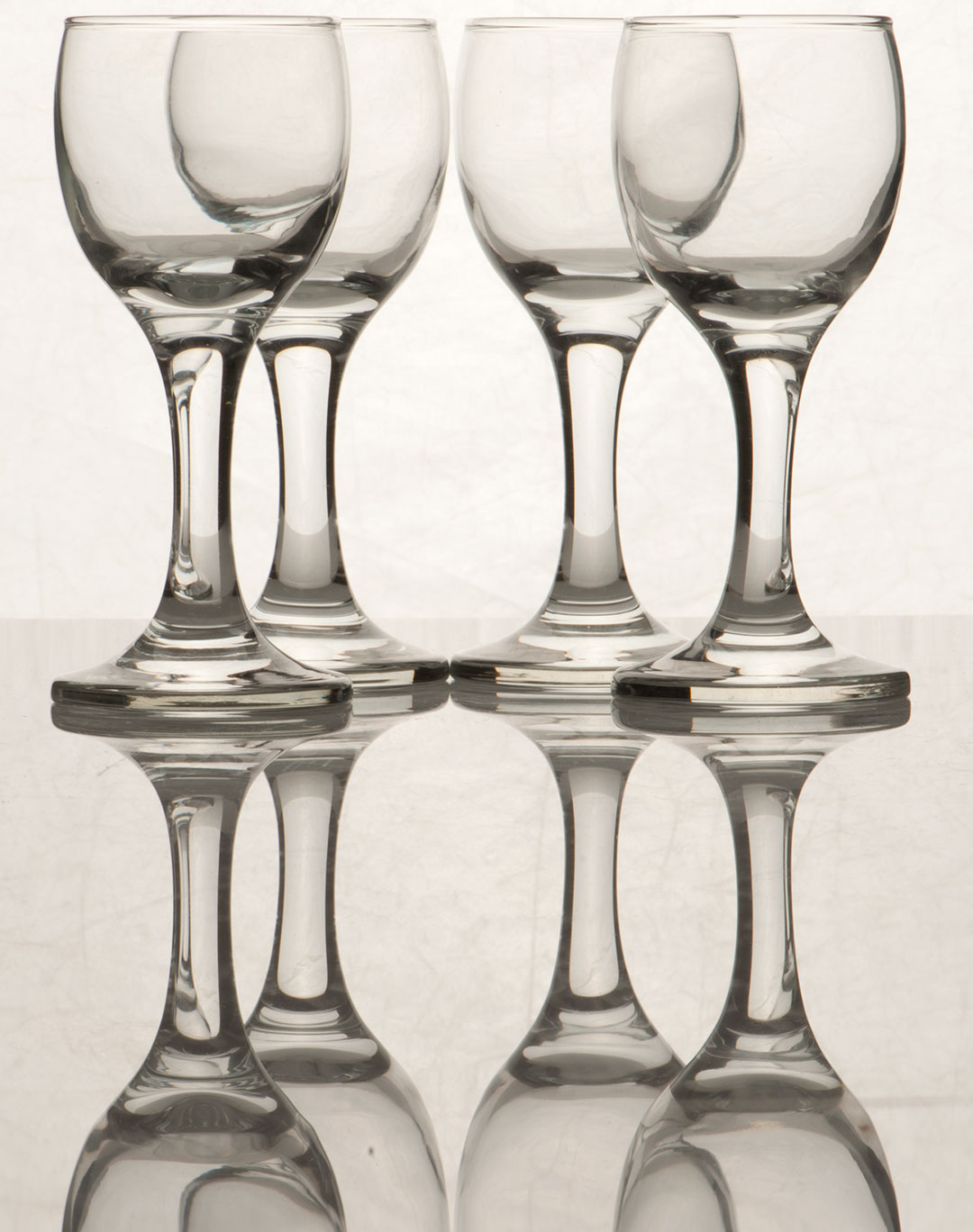 (Before Editing) Set of Glassware photographed to show reflection on clear surface